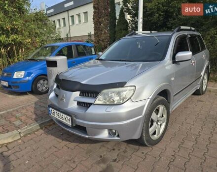 Серый Мицубиси Аутлендер, объемом двигателя 2.4 л и пробегом 243 тыс. км за 6999 $, фото 2 на Automoto.ua