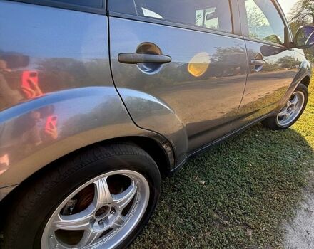 Серый Мицубиси Аутлендер, объемом двигателя 3 л и пробегом 280 тыс. км за 7500 $, фото 3 на Automoto.ua