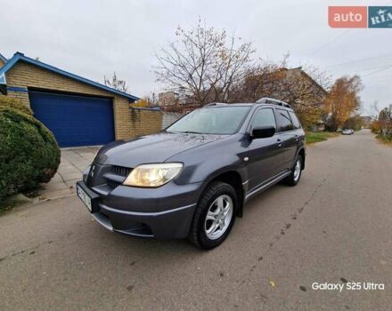 Серый Мицубиси Аутлендер, объемом двигателя 2 л и пробегом 240 тыс. км за 6300 $, фото 8 на Automoto.ua