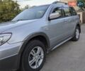 Сірий Міцубісі Аутлендер, об'ємом двигуна 2.38 л та пробігом 137 тис. км за 5500 $, фото 2 на Automoto.ua