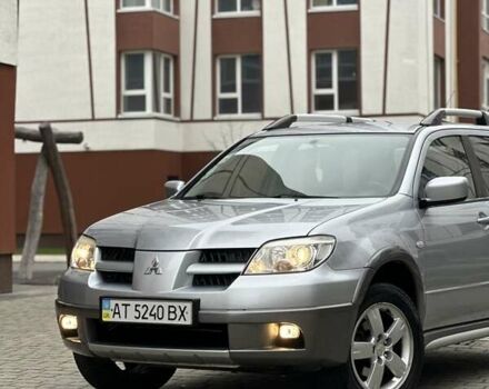 Сірий Міцубісі Аутлендер, об'ємом двигуна 2.4 л та пробігом 98 тис. км за 7199 $, фото 1 на Automoto.ua