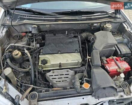 Серый Мицубиси Аутлендер, объемом двигателя 2.4 л и пробегом 243 тыс. км за 6999 $, фото 7 на Automoto.ua