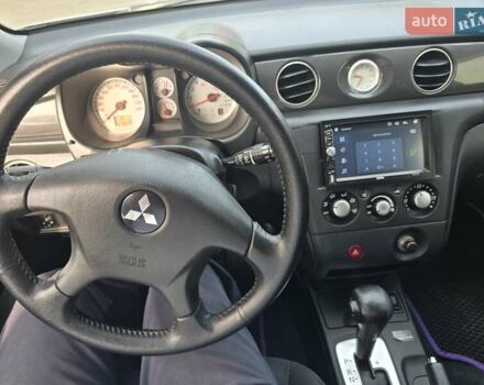 Серый Мицубиси Аутлендер, объемом двигателя 2.4 л и пробегом 243 тыс. км за 6999 $, фото 4 на Automoto.ua