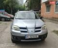 Серый Мицубиси Аутлендер, объемом двигателя 2 л и пробегом 240 тыс. км за 5700 $, фото 1 на Automoto.ua