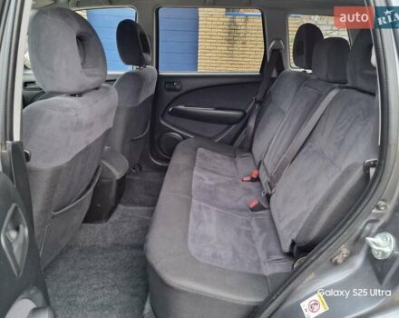 Серый Мицубиси Аутлендер, объемом двигателя 2 л и пробегом 240 тыс. км за 6300 $, фото 9 на Automoto.ua