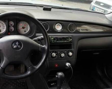 Серый Мицубиси Аутлендер, объемом двигателя 2.38 л и пробегом 228 тыс. км за 7900 $, фото 3 на Automoto.ua