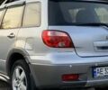 Серый Мицубиси Аутлендер, объемом двигателя 2.38 л и пробегом 280 тыс. км за 5500 $, фото 1 на Automoto.ua