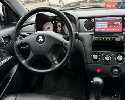 Серый Мицубиси Аутлендер, объемом двигателя 2.38 л и пробегом 204 тыс. км за 6990 $, фото 20 на Automoto.ua