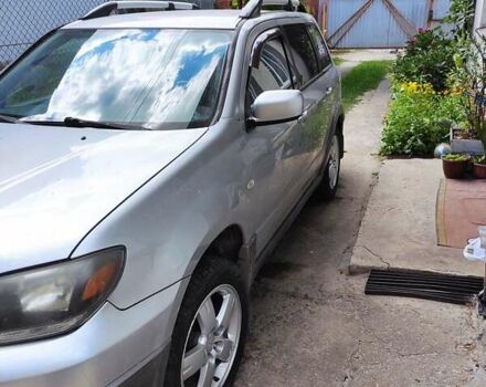 Серый Мицубиси Аутлендер, объемом двигателя 2.38 л и пробегом 161 тыс. км за 6400 $, фото 4 на Automoto.ua