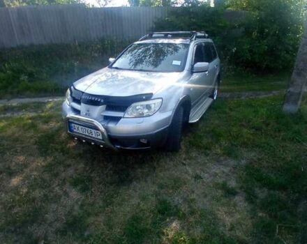 Сірий Міцубісі Аутлендер, об'ємом двигуна 2.38 л та пробігом 226 тис. км за 10000 $, фото 14 на Automoto.ua