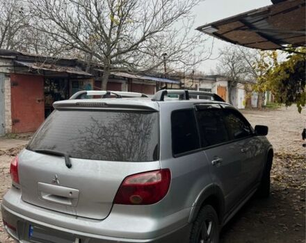 Серый Мицубиси Аутлендер, объемом двигателя 2.4 л и пробегом 282 тыс. км за 7500 $, фото 2 на Automoto.ua