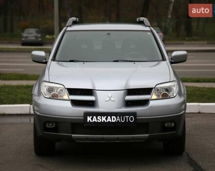 Серый Мицубиси Аутлендер, объемом двигателя 2.4 л и пробегом 171 тыс. км за 8200 $, фото 1 на Automoto.ua