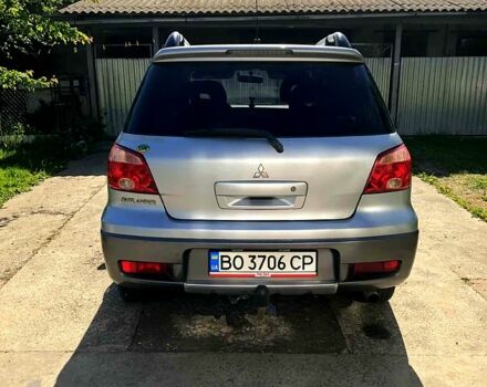 Серый Мицубиси Аутлендер, объемом двигателя 2 л и пробегом 228 тыс. км за 4900 $, фото 1 на Automoto.ua