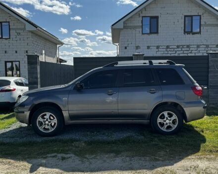 Серый Мицубиси Аутлендер, объемом двигателя 2 л и пробегом 209 тыс. км за 5999 $, фото 4 на Automoto.ua