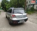 Серый Мицубиси Аутлендер, объемом двигателя 2 л и пробегом 240 тыс. км за 5700 $, фото 3 на Automoto.ua