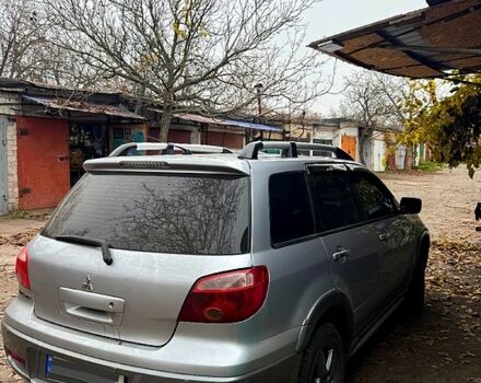 Серый Мицубиси Аутлендер, объемом двигателя 2.4 л и пробегом 285 тыс. км за 7500 $, фото 2 на Automoto.ua