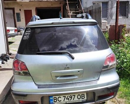 Серый Мицубиси Аутлендер, объемом двигателя 2.38 л и пробегом 161 тыс. км за 6400 $, фото 2 на Automoto.ua