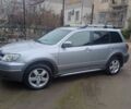 Серый Мицубиси Аутлендер, объемом двигателя 2.4 л и пробегом 240 тыс. км за 7300 $, фото 1 на Automoto.ua