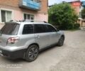 Серый Мицубиси Аутлендер, объемом двигателя 2 л и пробегом 240 тыс. км за 5700 $, фото 2 на Automoto.ua