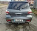 Серый Мицубиси Аутлендер, объемом двигателя 2 л и пробегом 154 тыс. км за 6500 $, фото 5 на Automoto.ua