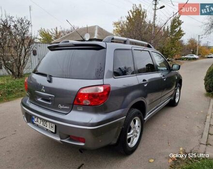 Серый Мицубиси Аутлендер, объемом двигателя 2 л и пробегом 240 тыс. км за 6300 $, фото 5 на Automoto.ua