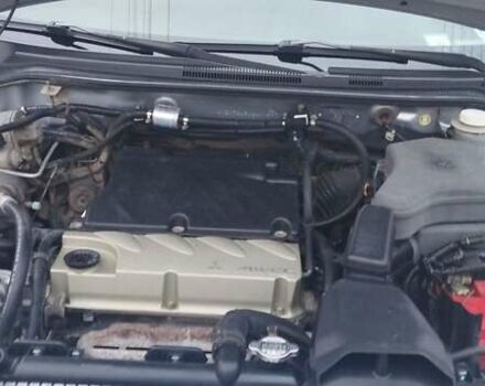 Серый Мицубиси Аутлендер, объемом двигателя 2.4 л и пробегом 261 тыс. км за 5700 $, фото 8 на Automoto.ua