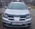 Серый Мицубиси Аутлендер, объемом двигателя 2.4 л и пробегом 261 тыс. км за 5700 $, фото 2 на Automoto.ua