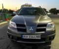 Серый Мицубиси Аутлендер, объемом двигателя 2 л и пробегом 240 тыс. км за 7000 $, фото 1 на Automoto.ua
