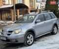 Серый Мицубиси Аутлендер, объемом двигателя 2.38 л и пробегом 150 тыс. км за 6500 $, фото 1 на Automoto.ua