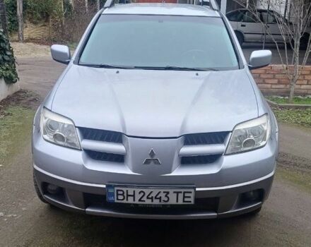 Серый Мицубиси Аутлендер, объемом двигателя 2.4 л и пробегом 240 тыс. км за 7300 $, фото 1 на Automoto.ua