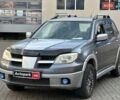 Серый Мицубиси Аутлендер, объемом двигателя 2.4 л и пробегом 298 тыс. км за 4990 $, фото 1 на Automoto.ua