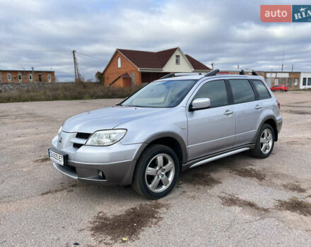 Серый Мицубиси Аутлендер, объемом двигателя 2.4 л и пробегом 264 тыс. км за 6300 $, фото 2 на Automoto.ua