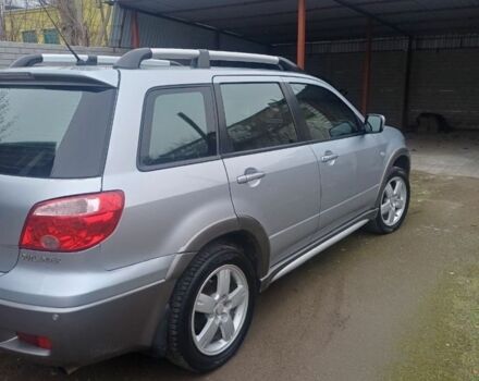 Серый Мицубиси Аутлендер, объемом двигателя 2.4 л и пробегом 240 тыс. км за 7300 $, фото 2 на Automoto.ua