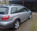 Серый Мицубиси Аутлендер, объемом двигателя 2.4 л и пробегом 240 тыс. км за 7300 $, фото 2 на Automoto.ua