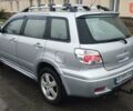 Серый Мицубиси Аутлендер, объемом двигателя 2.38 л и пробегом 204 тыс. км за 6100 $, фото 2 на Automoto.ua