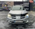 Серый Мицубиси Аутлендер, объемом двигателя 2.38 л и пробегом 280 тыс. км за 5800 $, фото 1 на Automoto.ua