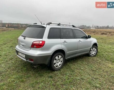 Серый Мицубиси Аутлендер, объемом двигателя 2 л и пробегом 270 тыс. км за 7000 $, фото 3 на Automoto.ua