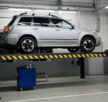 Серый Мицубиси Аутлендер, объемом двигателя 2.38 л и пробегом 238 тыс. км за 7450 $, фото 51 на Automoto.ua