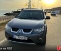 Серый Мицубиси Аутлендер, объемом двигателя 2.4 л и пробегом 215 тыс. км за 7000 $, фото 1 на Automoto.ua
