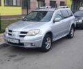 Серый Мицубиси Аутлендер, объемом двигателя 2.4 л и пробегом 306 тыс. км за 6400 $, фото 1 на Automoto.ua