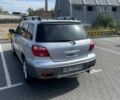 Серый Мицубиси Аутлендер, объемом двигателя 2 л и пробегом 235 тыс. км за 6699 $, фото 5 на Automoto.ua