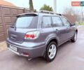 Серый Мицубиси Аутлендер, объемом двигателя 2.4 л и пробегом 240 тыс. км за 6900 $, фото 57 на Automoto.ua