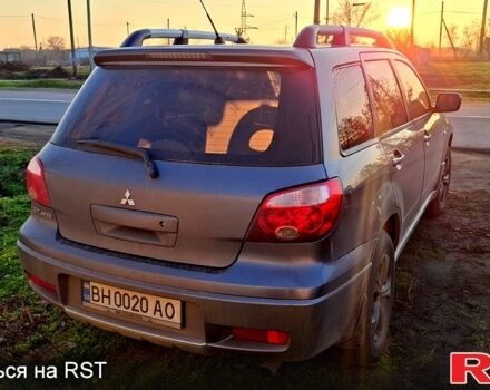 Сірий Міцубісі Аутлендер, об'ємом двигуна 2.4 л та пробігом 211 тис. км за 5000 $, фото 2 на Automoto.ua