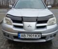 Серый Мицубиси Аутлендер, объемом двигателя 2.4 л и пробегом 300 тыс. км за 5900 $, фото 5 на Automoto.ua