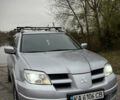 Серый Мицубиси Аутлендер, объемом двигателя 2.38 л и пробегом 238 тыс. км за 7450 $, фото 6 на Automoto.ua