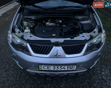 Серый Мицубиси Аутлендер, объемом двигателя 2.4 л и пробегом 236 тыс. км за 7600 $, фото 41 на Automoto.ua