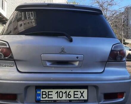 Серый Мицубиси Аутлендер, объемом двигателя 2.4 л и пробегом 230 тыс. км за 6000 $, фото 7 на Automoto.ua