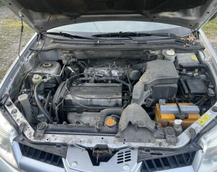 Серый Мицубиси Аутлендер, объемом двигателя 2 л и пробегом 190 тыс. км за 5300 $, фото 7 на Automoto.ua