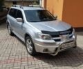 Серый Мицубиси Аутлендер, объемом двигателя 2.38 л и пробегом 230 тыс. км за 8300 $, фото 1 на Automoto.ua