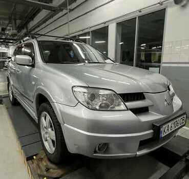 Серый Мицубиси Аутлендер, объемом двигателя 2.38 л и пробегом 238 тыс. км за 7450 $, фото 52 на Automoto.ua